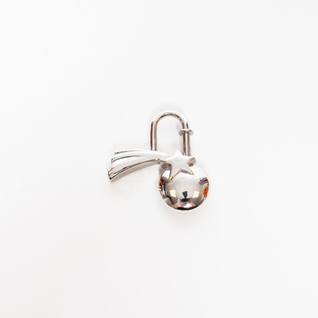 Hermès Charm Cadena Lock Shooting Star Aus Metall In Silber