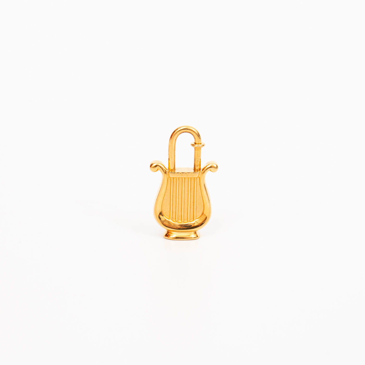 Breloque de sac Hermès Cadena Harp Lock Or